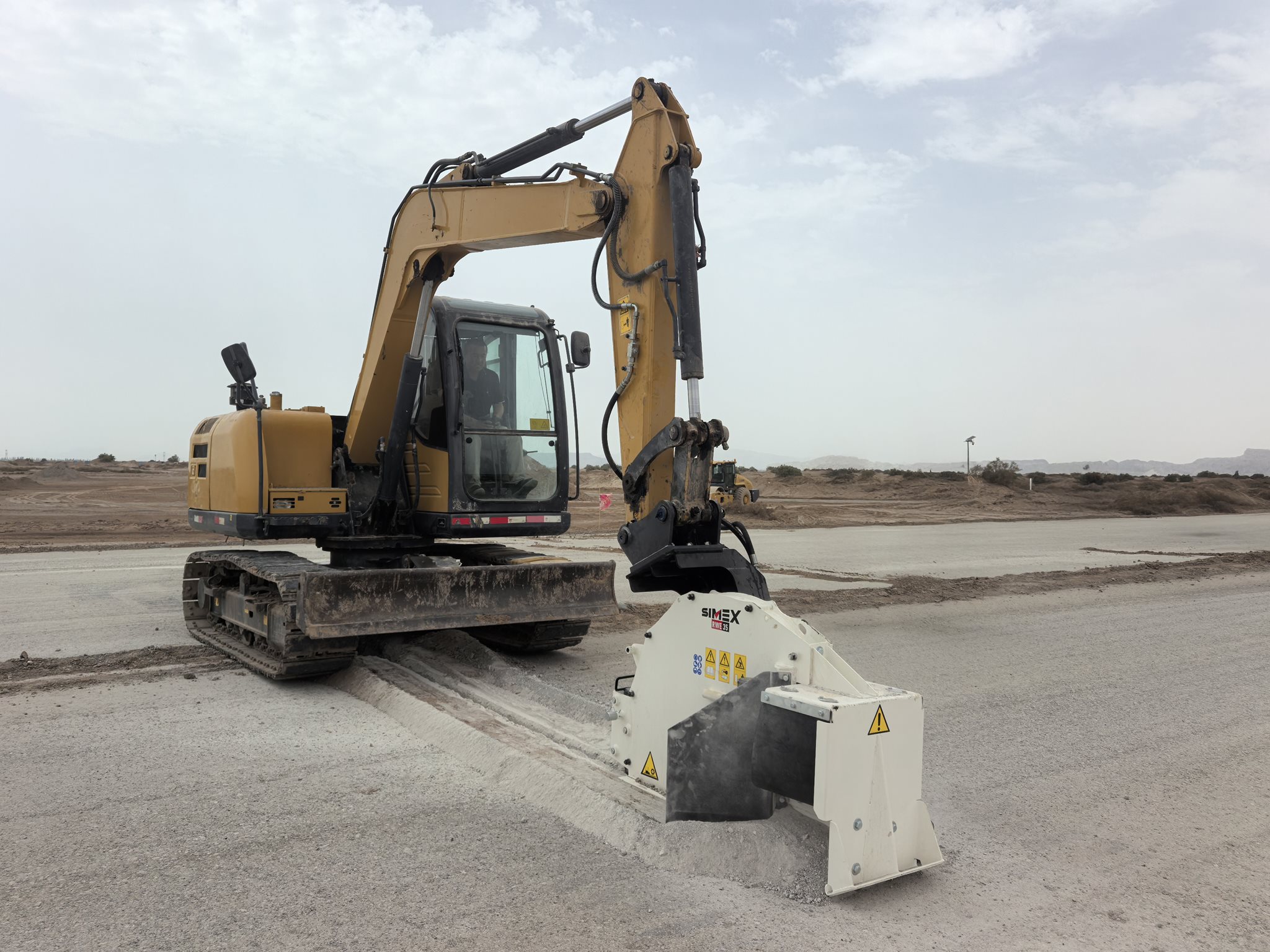 A Simex RWE 35 wheel saw trencher at work in China